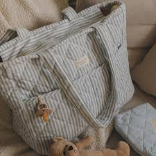 Sac à couche rayé bleu - Dans le sac